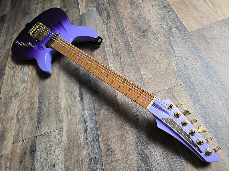 Purple electric guitar with a richlite fretboard and Evertune bridge