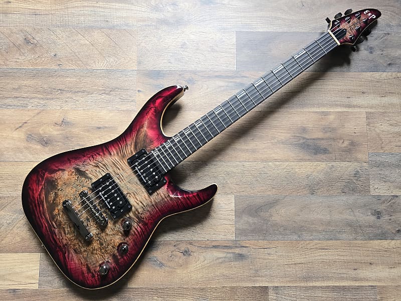 Electric guitar with a unique finish on a wooden surface