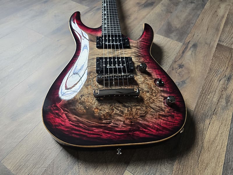 Electric guitar with a unique red and brown finish and Seymour Duncan pickups