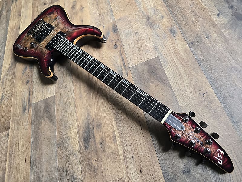 Pink and black ESP guitar with ebony fretboard and gloss finish