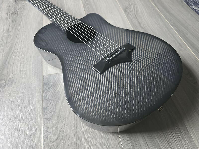 Carbon fiber guitar on a wooden floor