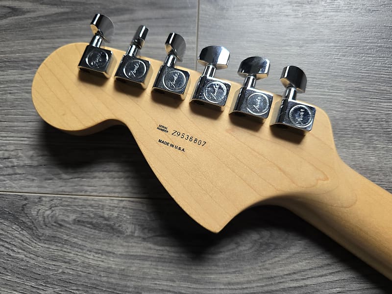 Guitar headstock with tuning pegs and serial number