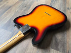 Electric guitar body with sunburst finish on a wooden floor