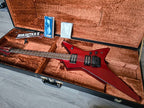 Red Ibanez electric guitar in an open brown case with Roadstar II branding.