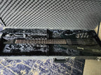 Ibanez electric guitar in a black case on a textured surface