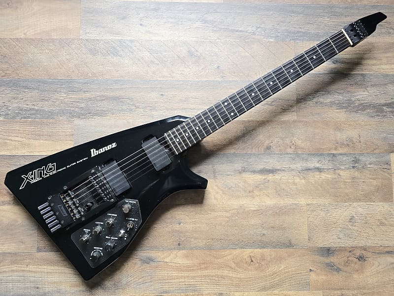Black Ibanez Midi guitar on a wooden surface