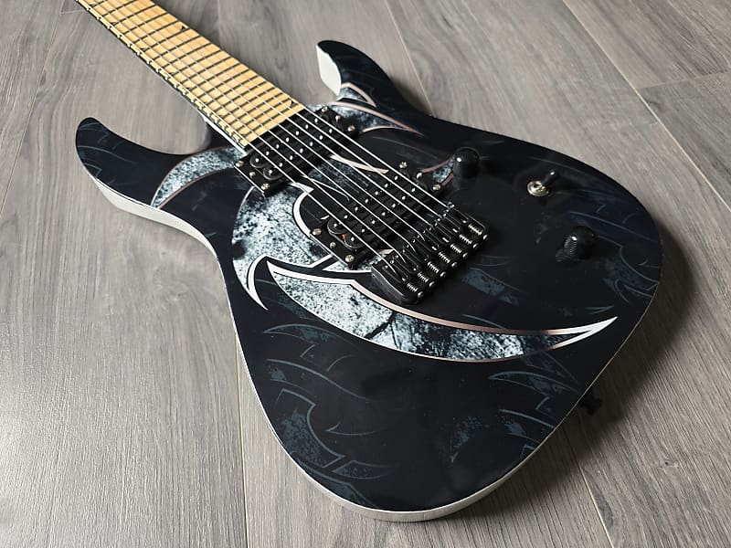 Electric guitar with a black and white design and basswood body