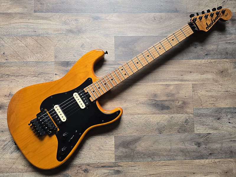 Masterbuilt Jackson guitar on a wooden floor