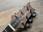 Guitar headstock with 'PRS McCarty 594' branding 
