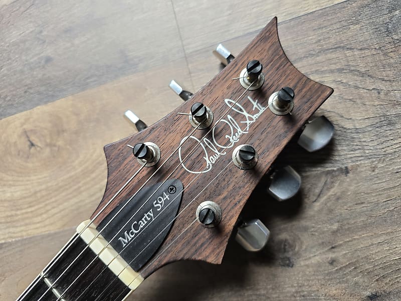 Guitar headstock with 'PRS McCarty 594' branding 