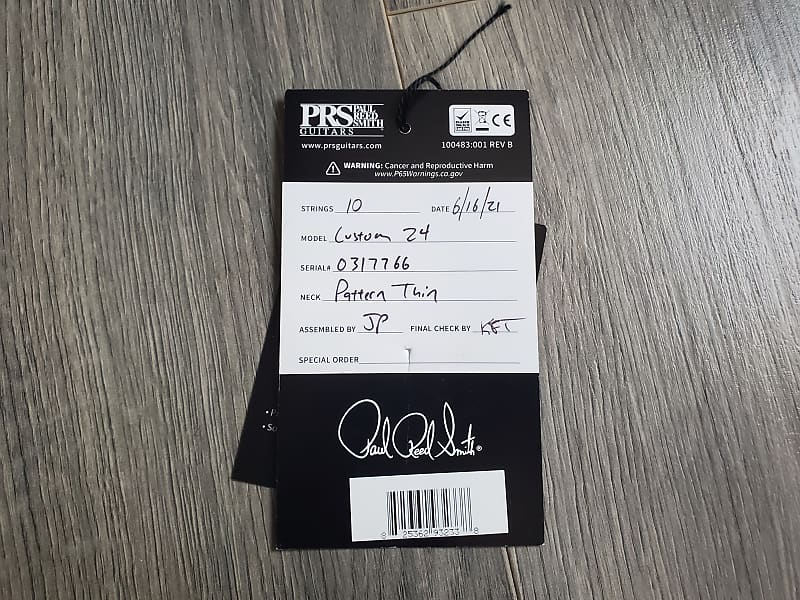Product tag for a Paul Reed Smith guitar with model and serial number