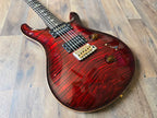 PRS electric guitar with a red glossy body and gold hardware