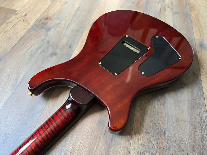 Guitar body on a wooden surface