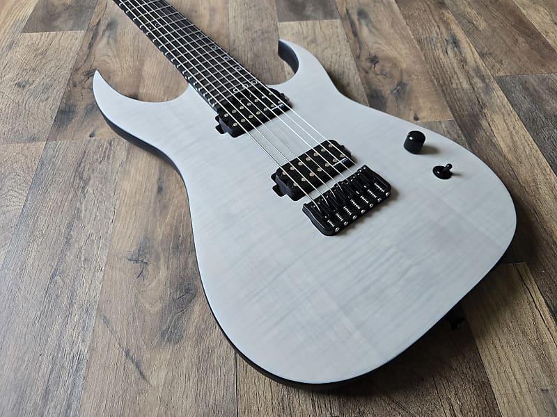 white electric guitar with black hardware 