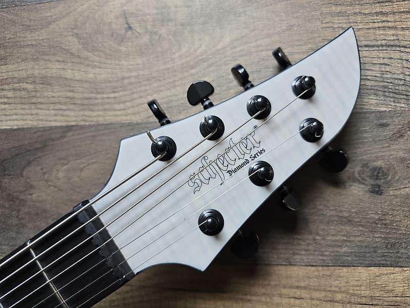 Guitar headstock of a Schecter Keith Merrow KM7