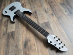 White electric guitar on a wooden floor