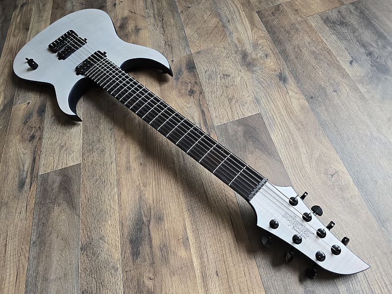 White electric guitar on a wooden floor