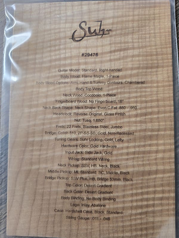 Certificate with engraved specifications and 'Suhr' branding.