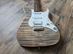 Striped electric guitar with a wood finish on a wooden floor