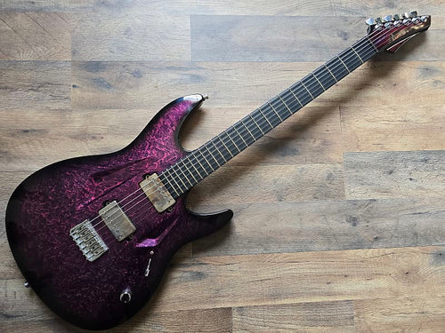 Pink and black Aristides 060 custom electric guitar
