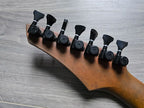 Guitar tuning pegs on the back of a guitar headstock 