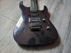 Dark maroon electric guitar with Seymour Duncan pickups on a gray wooden surface.