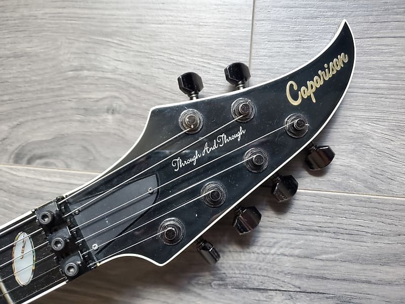 Caparison guitar headstock on a wooden surface