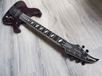 Crimson Caparison electric guitar with a Gotoh Floyd Rose lying on a wooden surface.