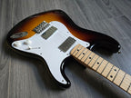 Sunburst electric guitar on a wooden floor