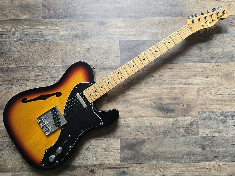 Fender Telecaster electric guitar on a wooden surface