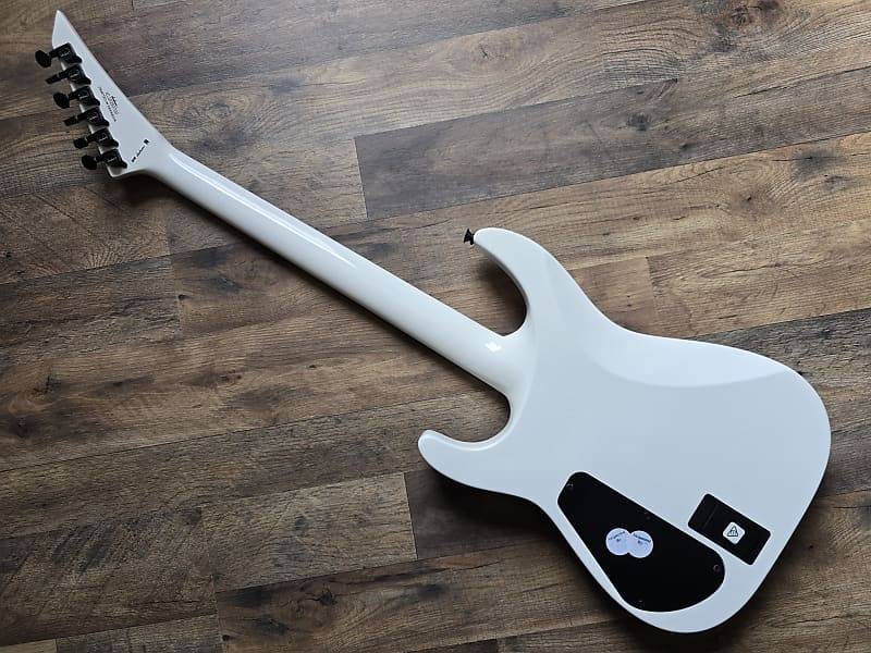Back of white Jackson electric guitar 