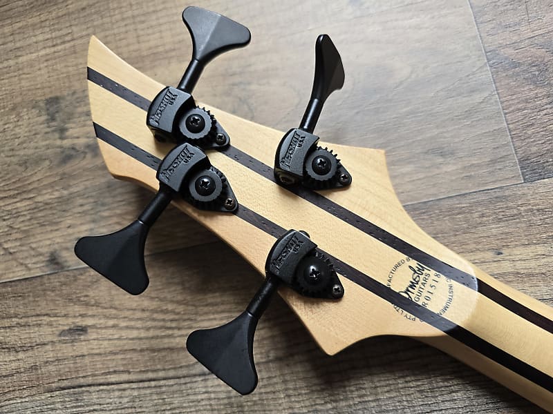 Back view of Ormsby BassGTR 4 headstock with logo and tuning machines