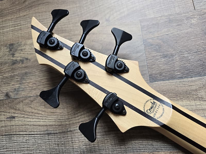Rear view of Ormsby BassGTR 5 headstock with logo and tuning machines