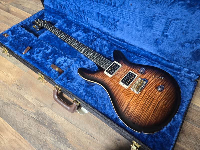 PRS Custom 24 resting in electric blue-lined guitar case