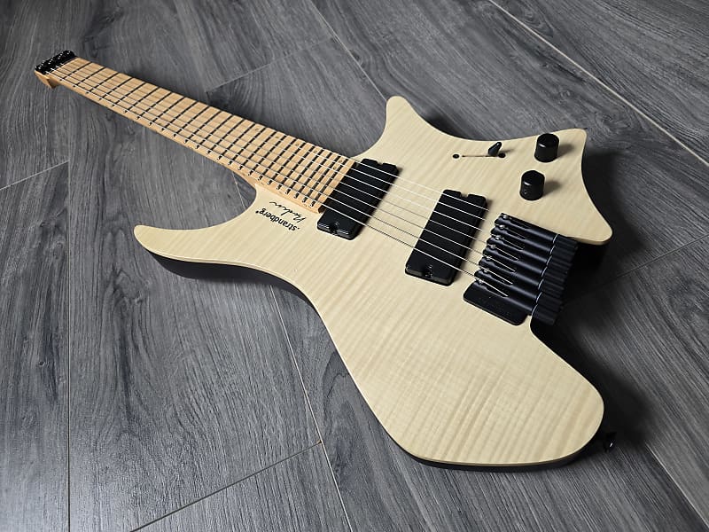 Lightweight electric guitar with a light ash body and quilted maple top