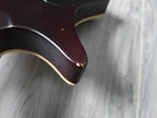 Close-up of a small scuff mark on an electric guitar