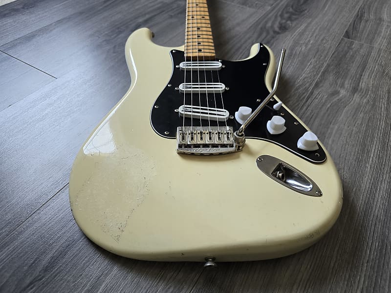 Vintage white electric guitar with a Floyd Rose tremolo and built-in hyperswitch Bluetooth system