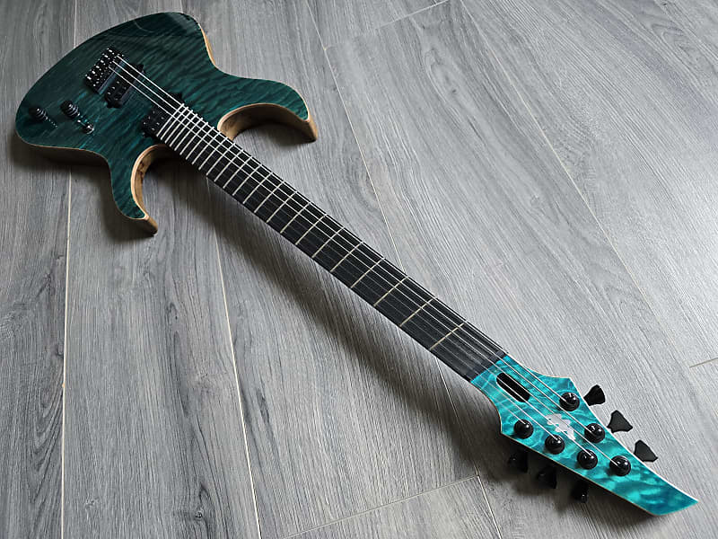Turquoise electric guitar with an ebony fretboard